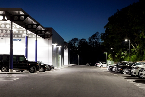 Outdoor lighting control is trending toward individual multilevel control. At the Collection Auto Group Fort Mitchell dealership, the lights dim to 10 percent of light output at night (schedule) but automatically ramp up to full output if a vehicle approaches (occupancy sensing). Image courtesy of GE Lighting.